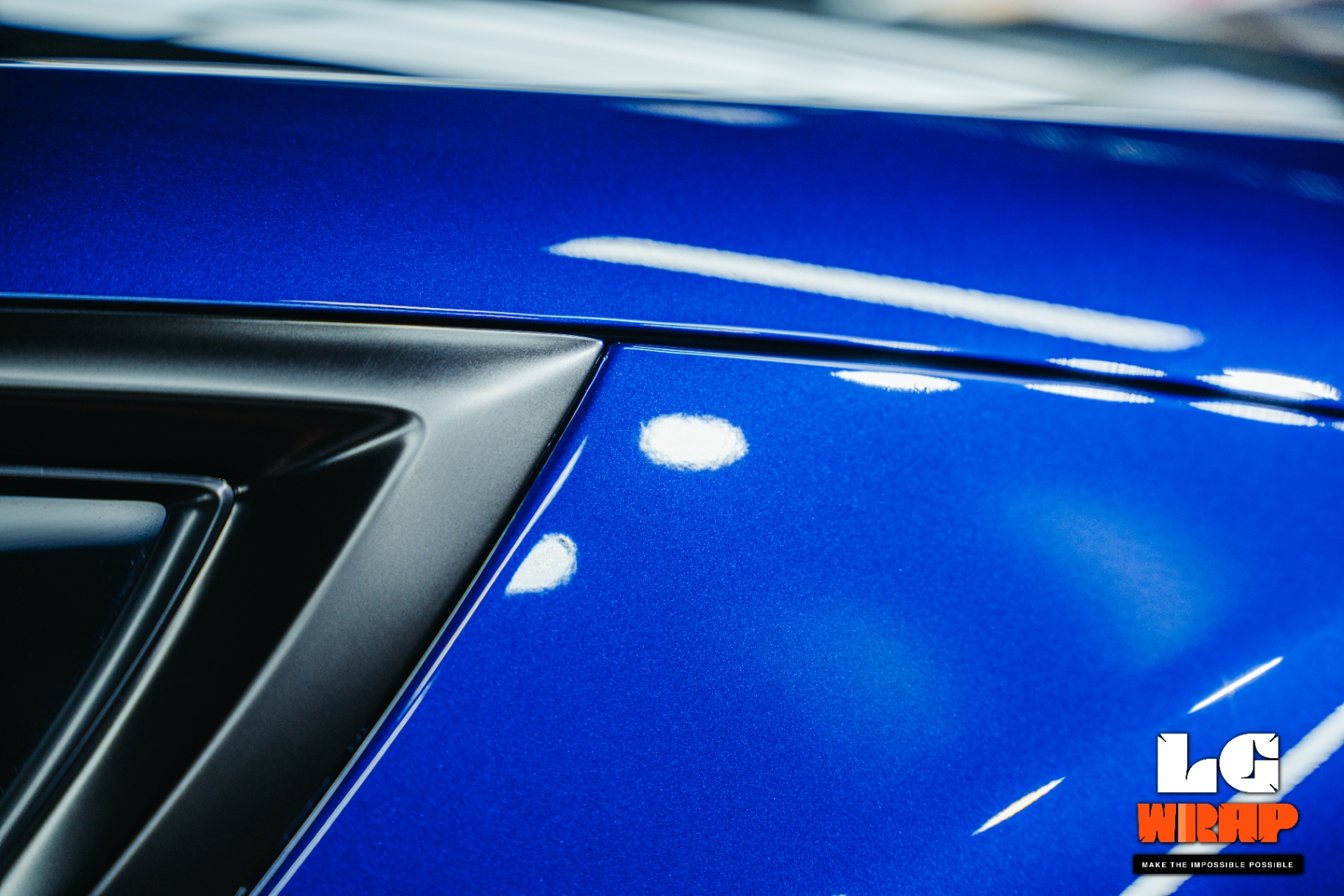 Close-up of blue metallic paint with mirror-like gloss under GSWF TPU PPF protection