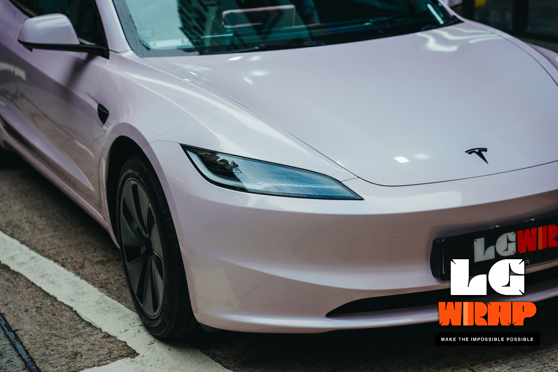 Close-up of a light pink Tesla Model 3 Highland front, showing CYBRIX Colour PPF effect