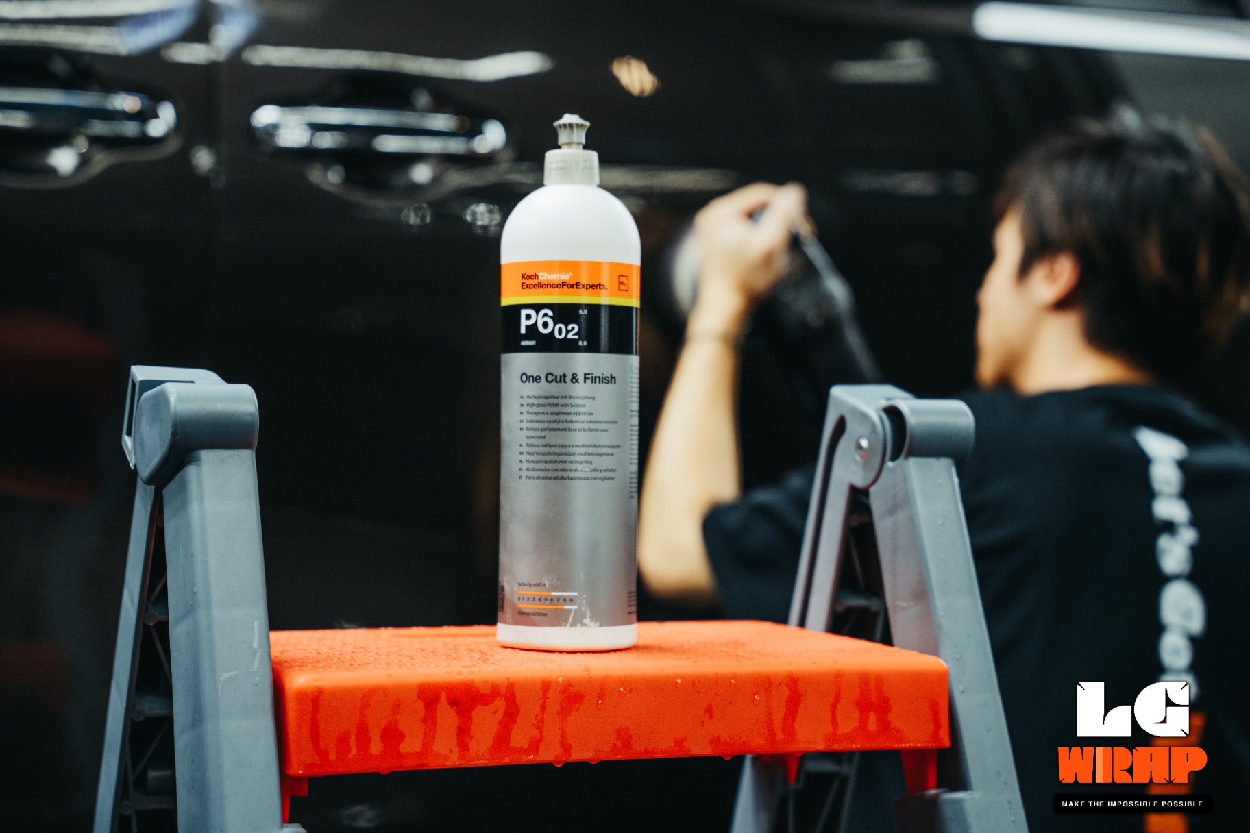 Letsgetwrap technician polishing the side of a dark brown MPV with Koch-Chemie P6.02