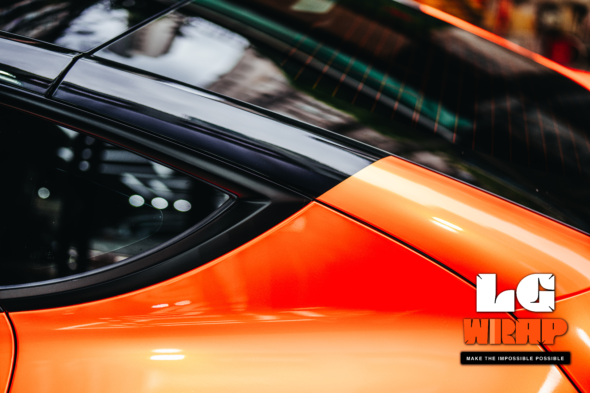 Close-up of orange Tesla body Colour PPF edge finishing and paint texture