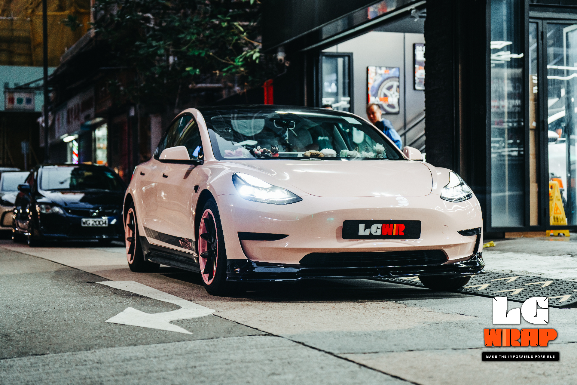 Street photo of a Tesla Model 3 with full car CYBRIX Colour PPF completed in front of LGWR Kwun Tong flagship store