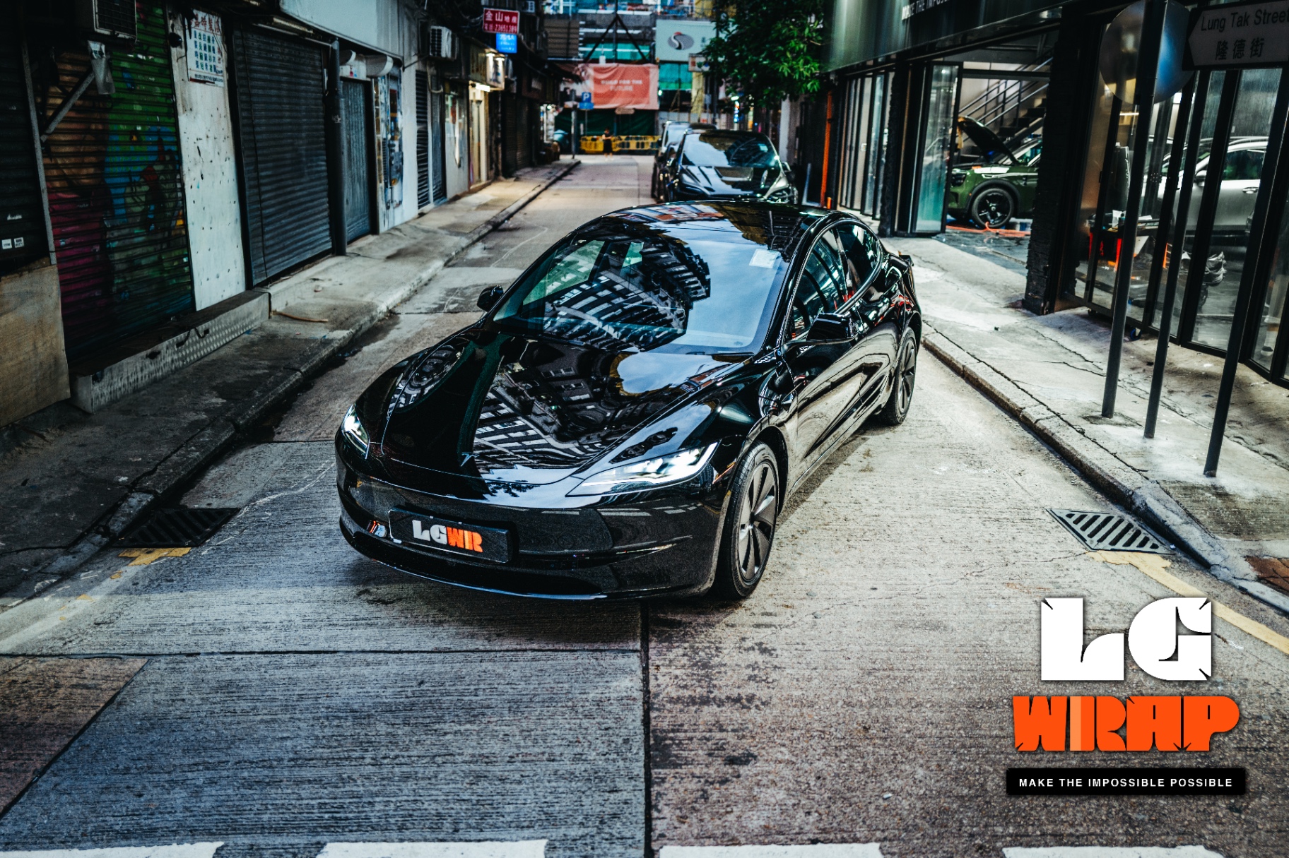 Front street view of a black Tesla Model 3 after full car clear PPF application