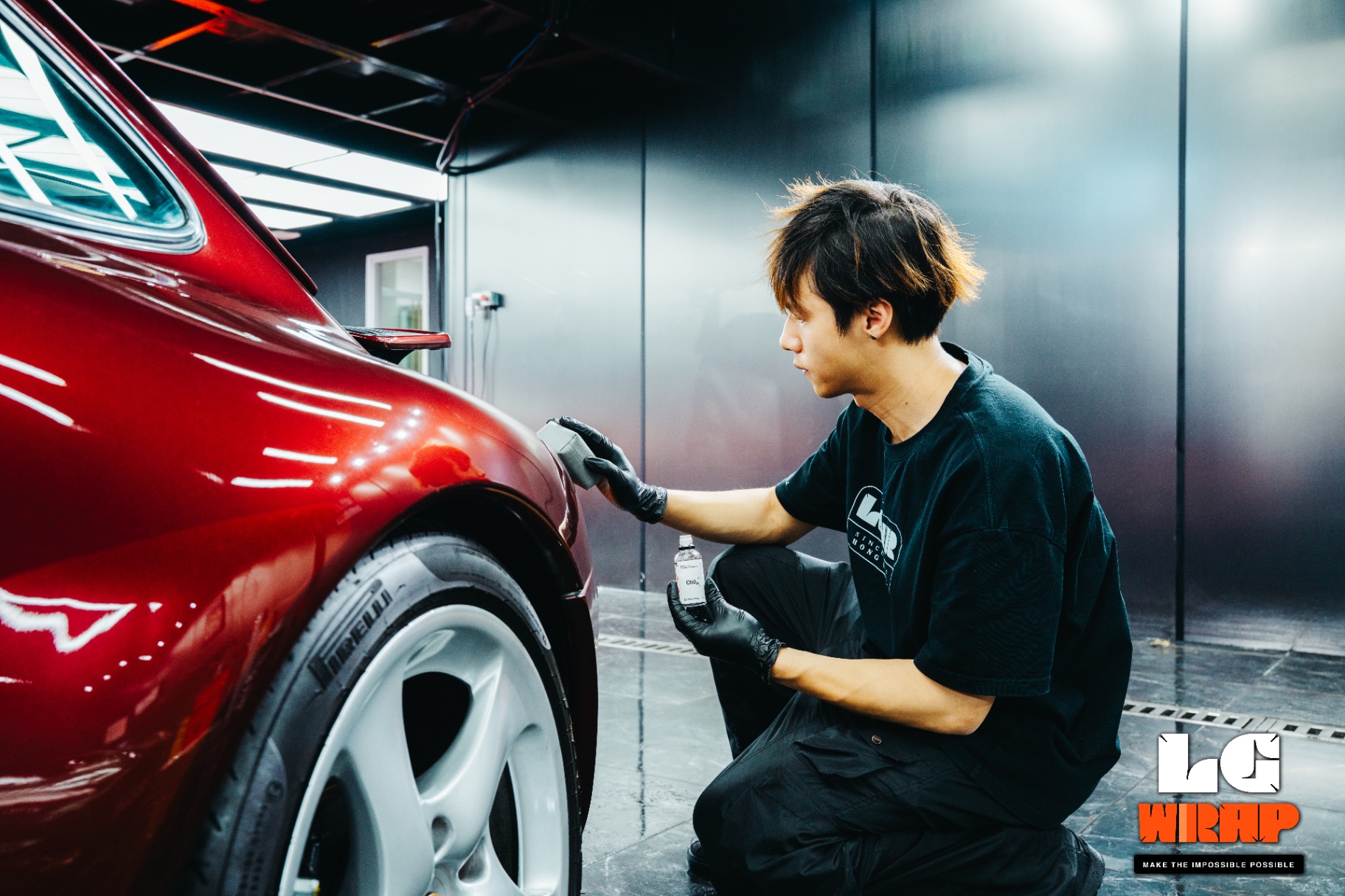 Letsgetwrap technician focusing on paint correction for Porsche 993 rear wheel arch