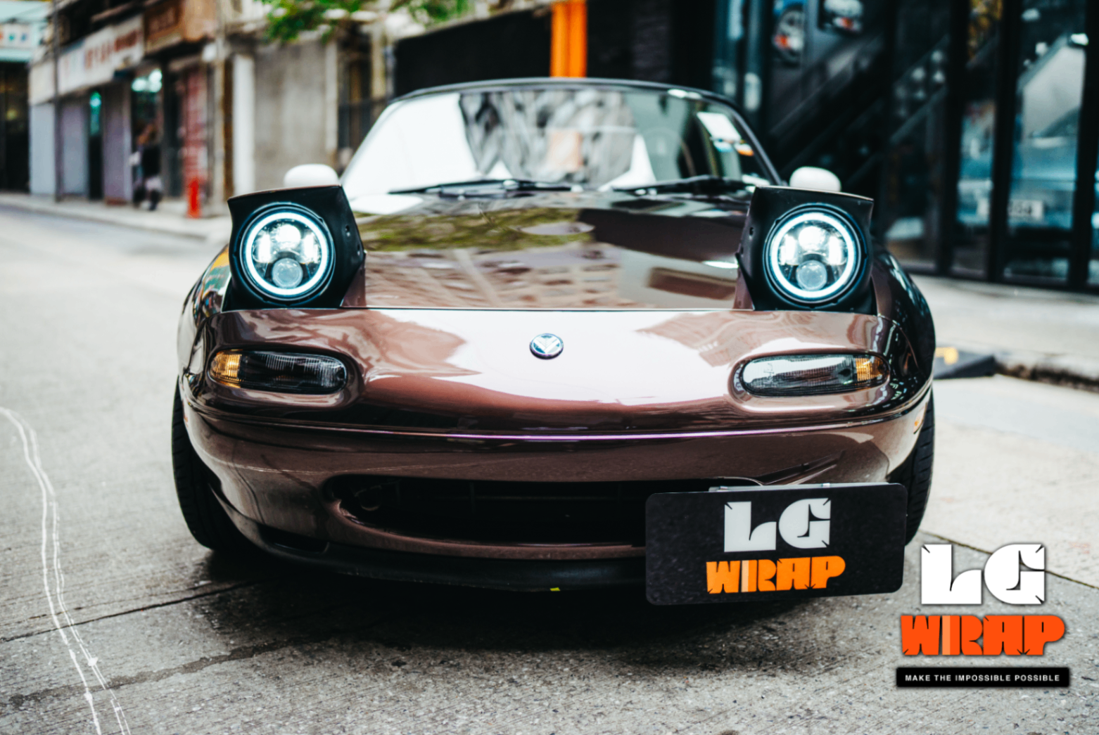 Front view of the completed 1995 Mazda MX-5 NA, wrapped in CYBRIX Metallic Leblon Purple Color PPF