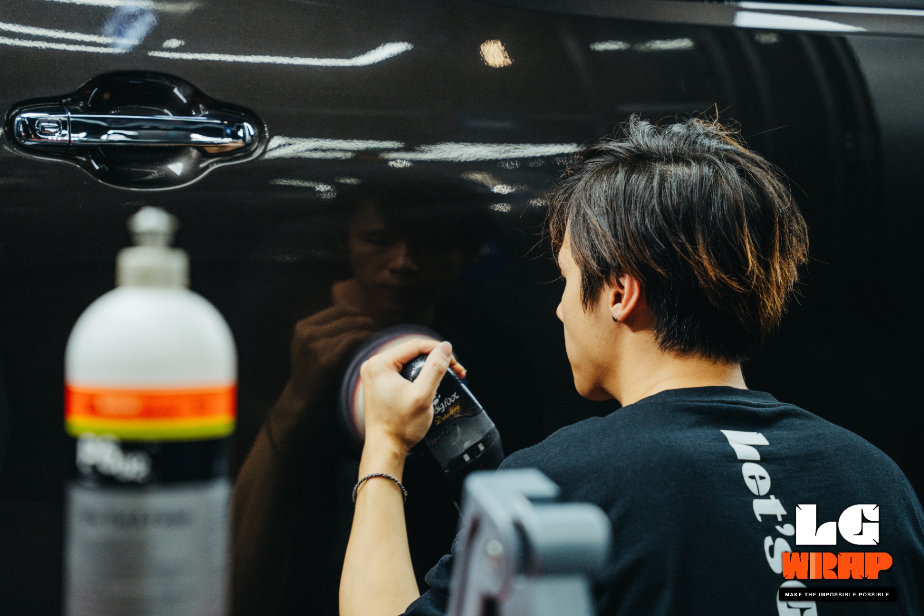 Polished car door showing a deep, mirror-like reflection